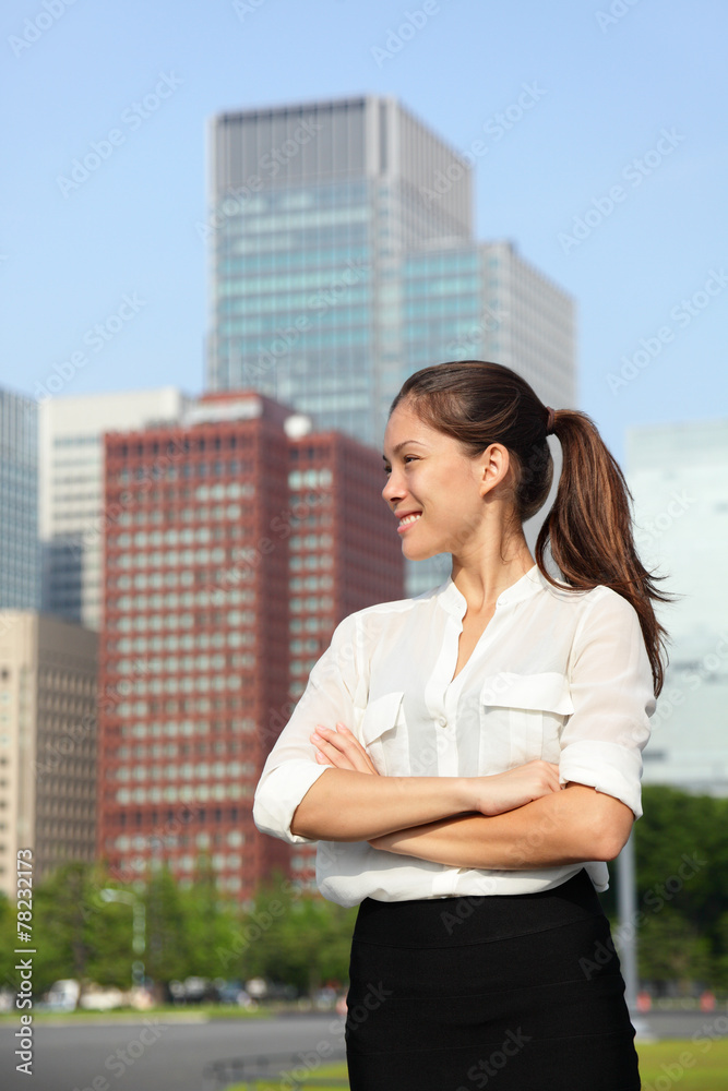 Asian businesswoman happy in urban Tokyo city Asian businesswoman happy in urban Tokyo city