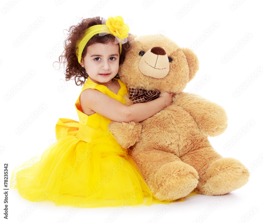 Cheerful caucasian girl in a yellow dress Cheerful caucasian girl in a yellow dress