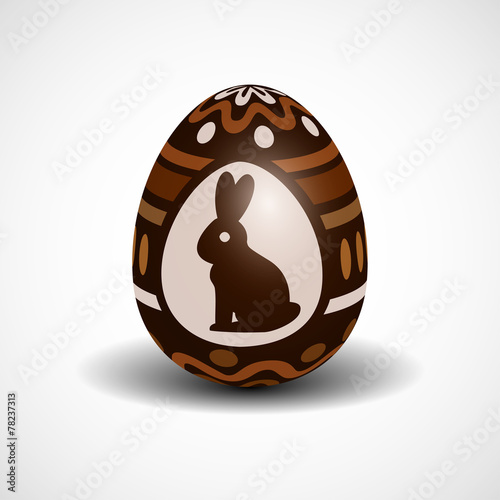 chocolate Easter egg with ornament and rabbit