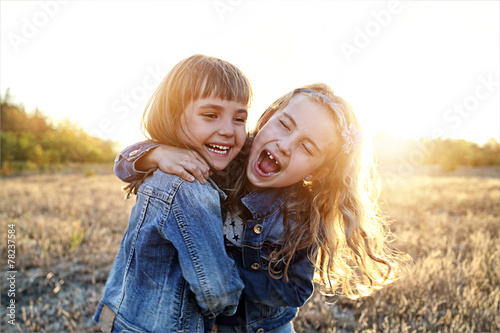 Two young girls have fun outside