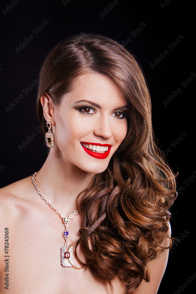 beautiful brunette woman with long hair wearing a lot of jewelry