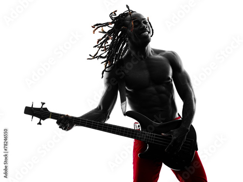 Foto african man guitarist bassist  player playing silhouette