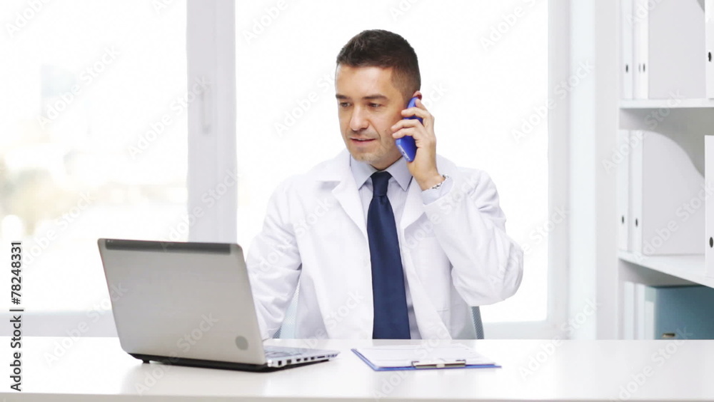 happy doctor with laptop calling on smartphone