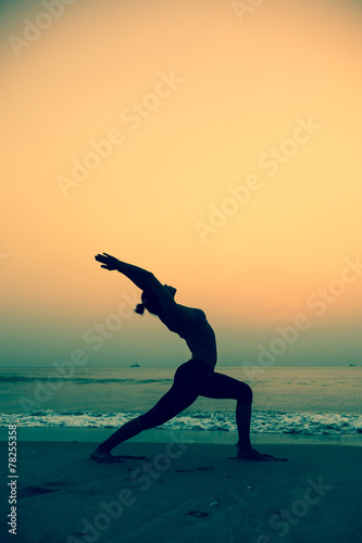  young woman practicing yoga