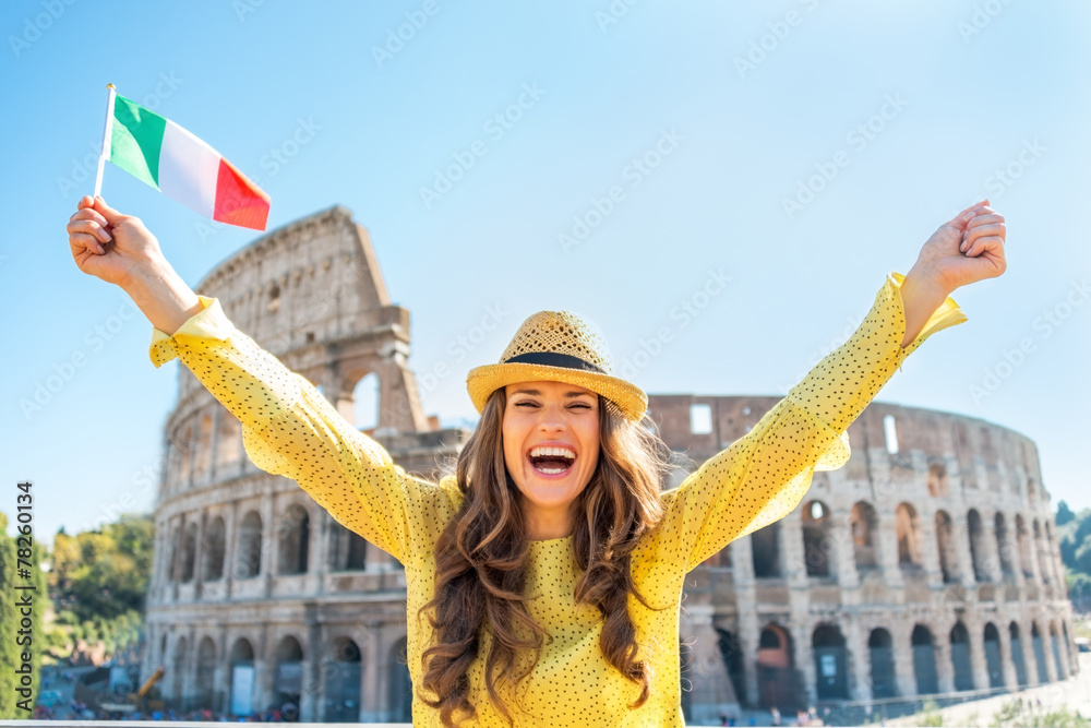 Obraz premium Portrait of happy woman rejoicing with italian flag in Rome