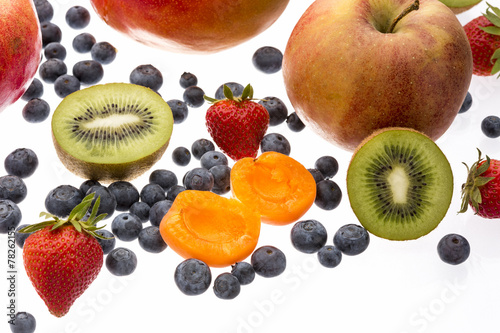 Fototapeta Naklejka Na Ścianę i Meble -  Halved Apricot And Kiwi Amidst Other Fruit