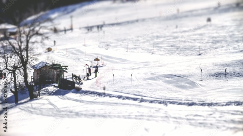 Skiers on alpine swiss ski slope Skiers on alpine swiss ski slope