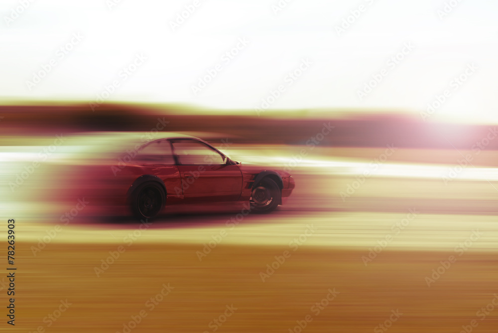 drift car motion blur sunrise or sunset