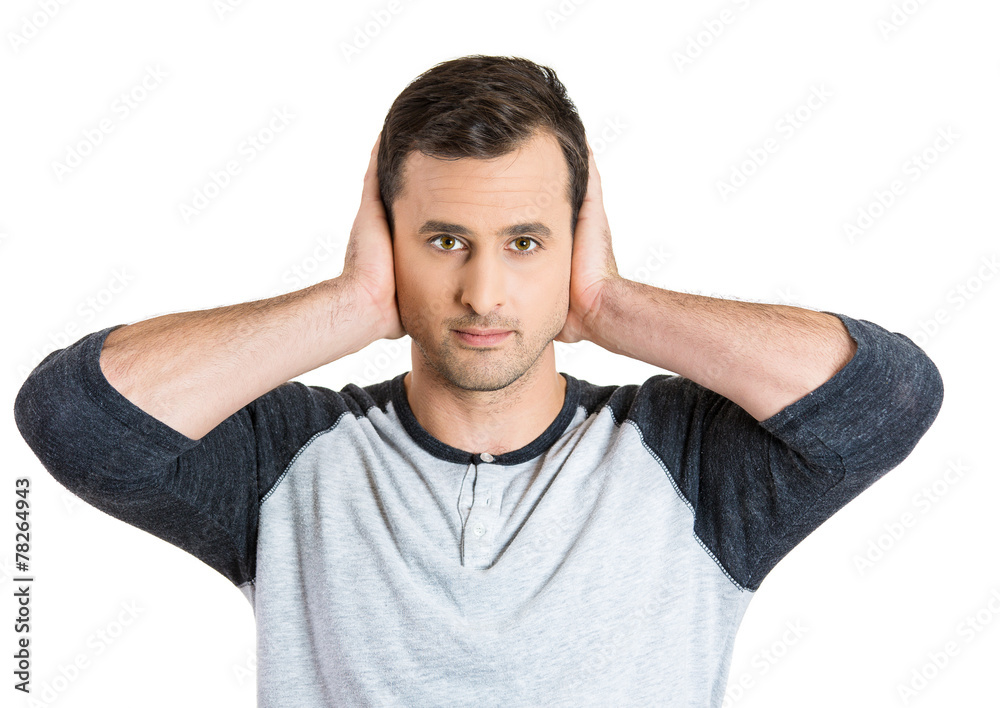 Portrait young man covering his ears with hands Portrait young man covering his ears with hands