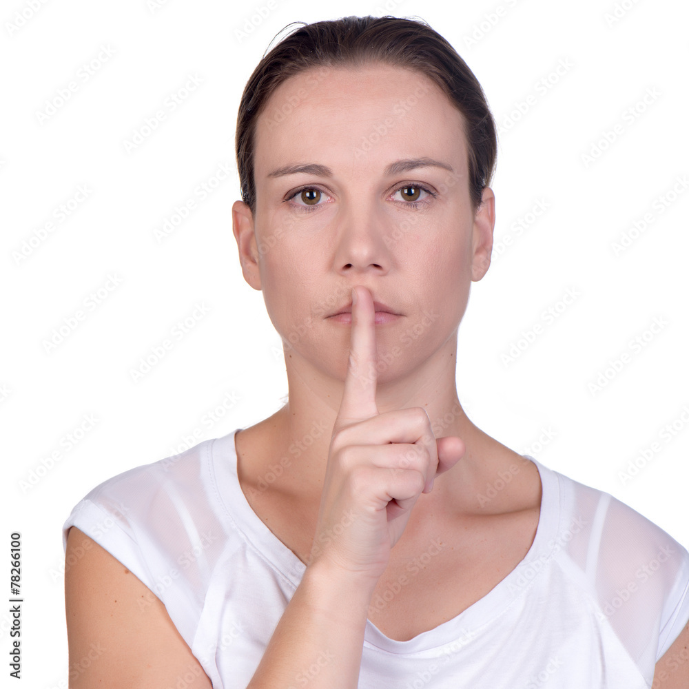 woman holding finger in front of her lips woman holding finger in front of her lips