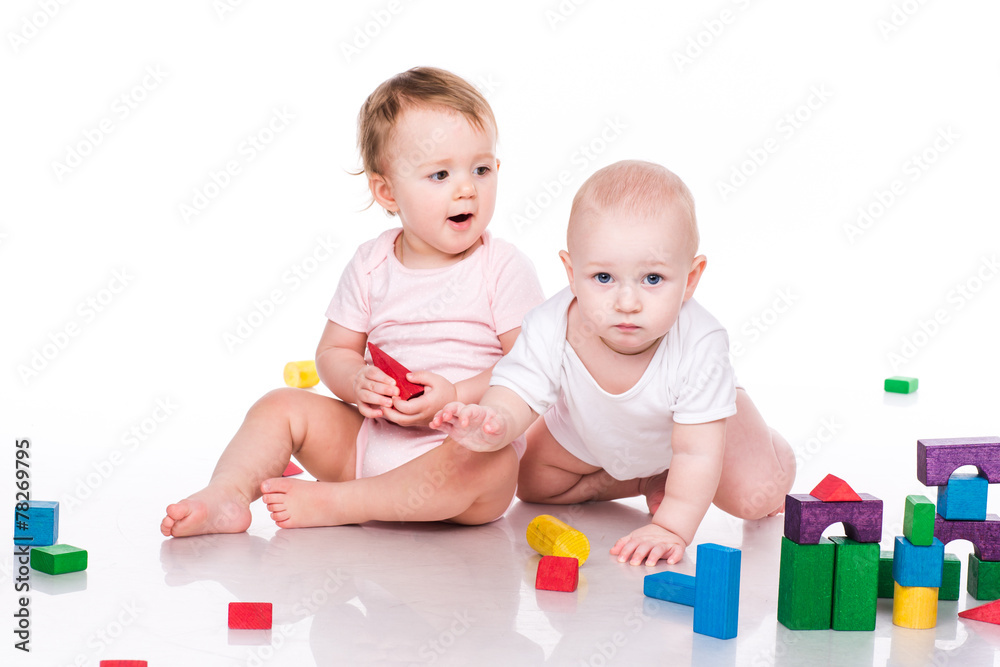 Beautiful babies building with cubes Beautiful babies building with cubes