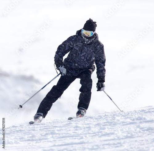 Skier in high mountains
