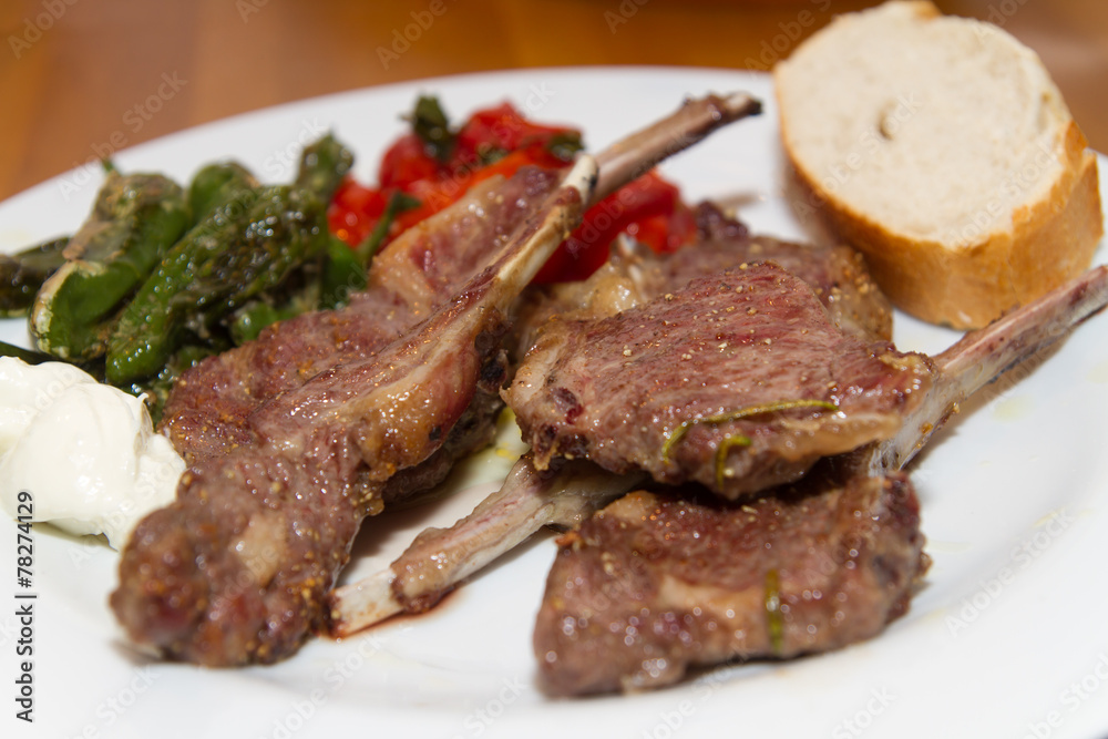 lamb racks with pimentos de padron and tomatos