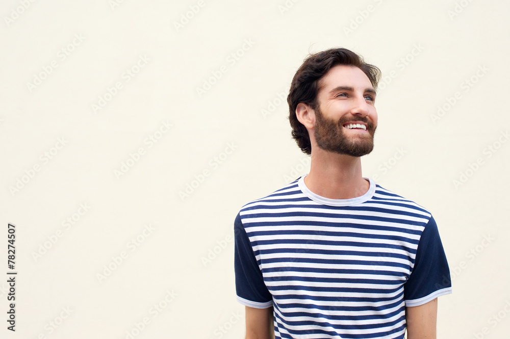 Cheerful young man with beard smiling on white background Cheerful young man with beard smiling on white background