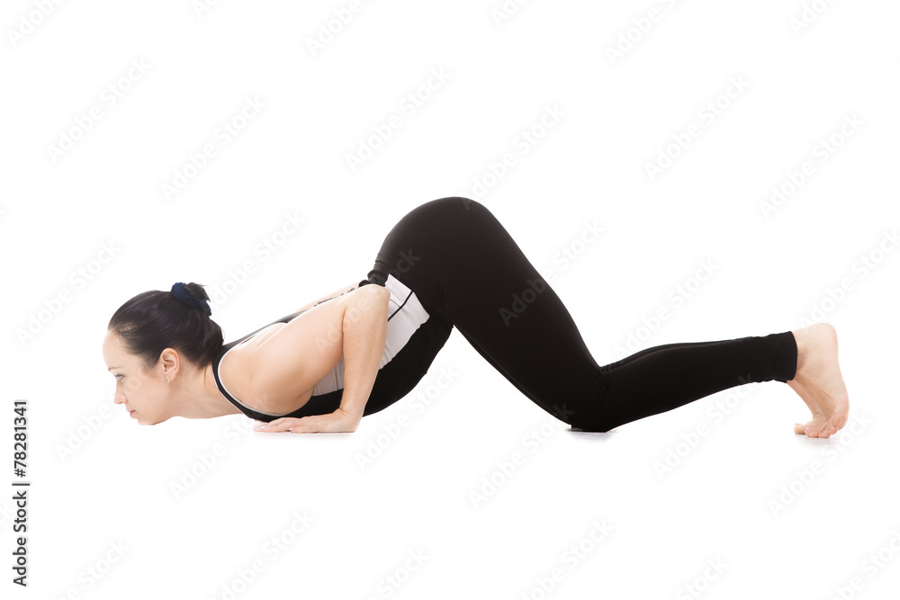 Yogi female in yoga Eight-Limbed Posture