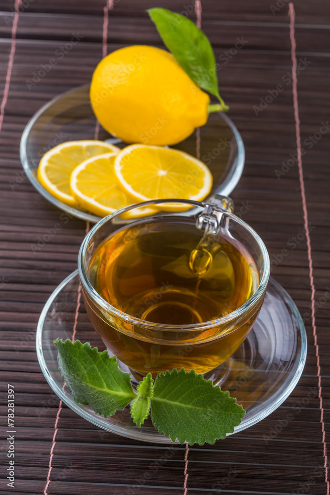 Glass cup of tea with mint and lemon Glass cup of tea with mint and lemon
