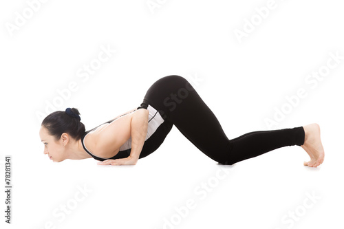 Yogi female in yoga Eight-Limbed Posture