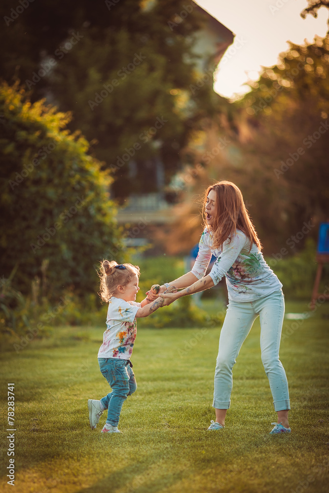Mother and little daughter playing together Mother and little daughter playing together