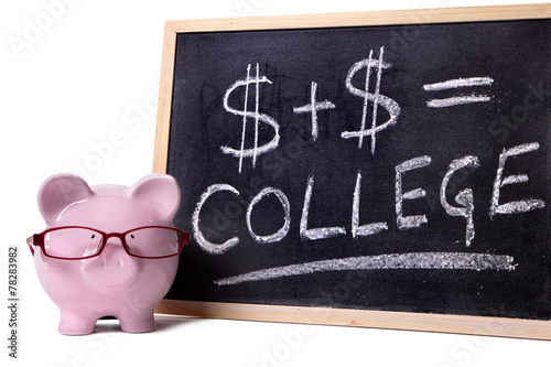 Piggy Bank or piggybank with college fund savings or fees chart written on smaill blackboard isolated on white background photo