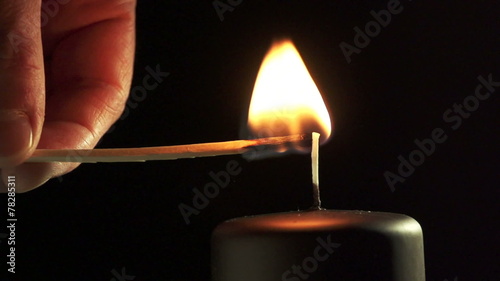 Slow motion of match and candle. Find similar in our portfolio.