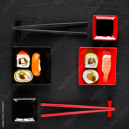 Sushi set on black stone table top view