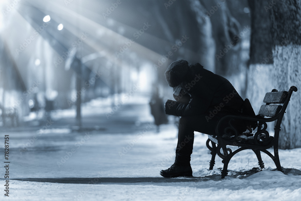 Depressed woman on a bench Depressed woman on a bench