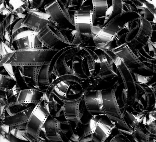 Bilde på lerret Unrolled heap 35mm movie filmstrip carpet vintage black and whit