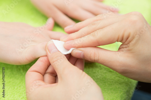remove nail polish with  cotton pad