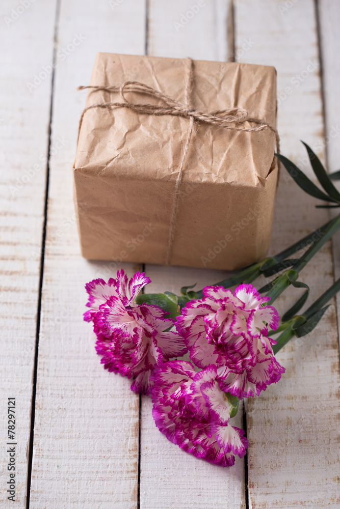 Carnations flowers and gift box