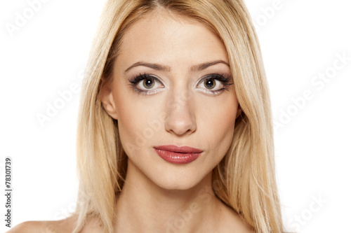 Portrait of beautiful blonde on white background