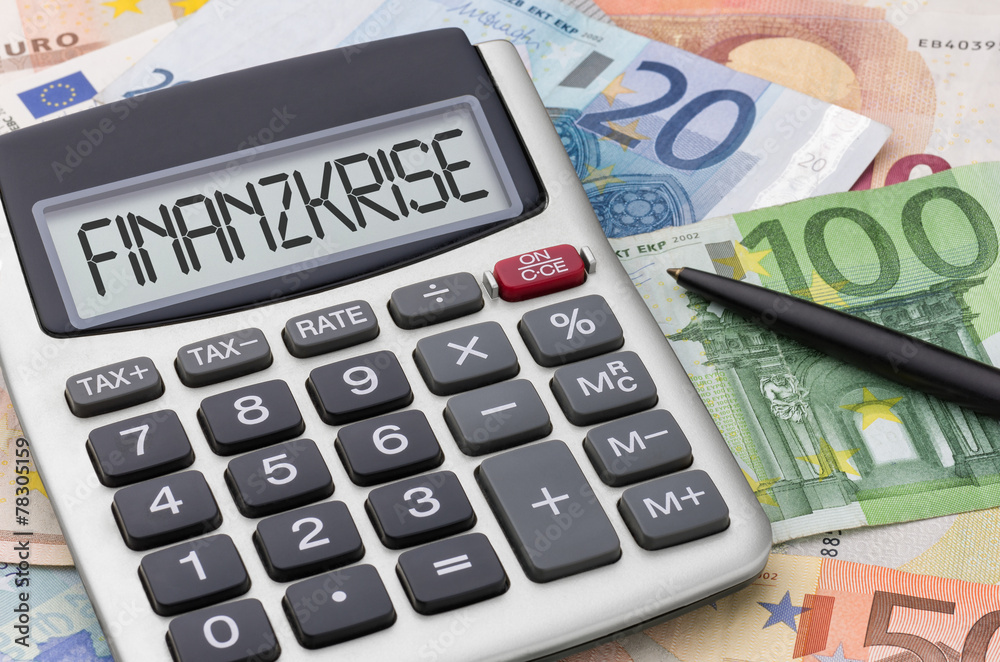 Taschenrechner mit Geldscheinen - Finanzkrise Taschenrechner mit Geldscheinen - Finanzkrise