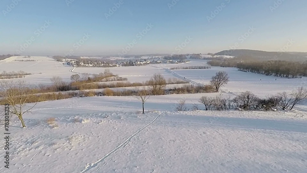 flying over snow-covered winter landscape in southern germany flying over snow-covered winter landscape in southern germany