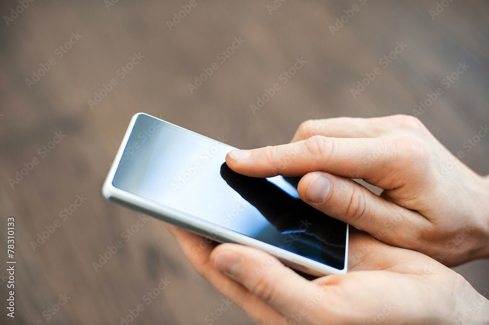 Young adult using mobile smart phone