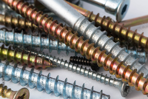 various screws and bolts on a white background photo