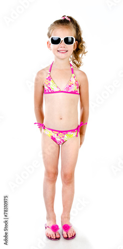 Cute smiling little girl in swimsuit and sunglasses isolated © svetamart