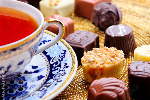 various chocolate candies with tea