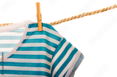 blue tshirt hanging on a rope clothesline