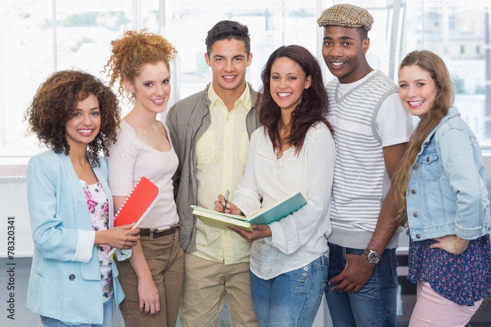 Fashion students smiling at camera together Fashion students smiling at camera together