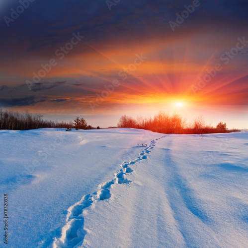 Sunset and pathway on snow