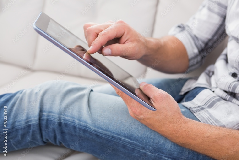 A man using a tablet A man using a tablet
