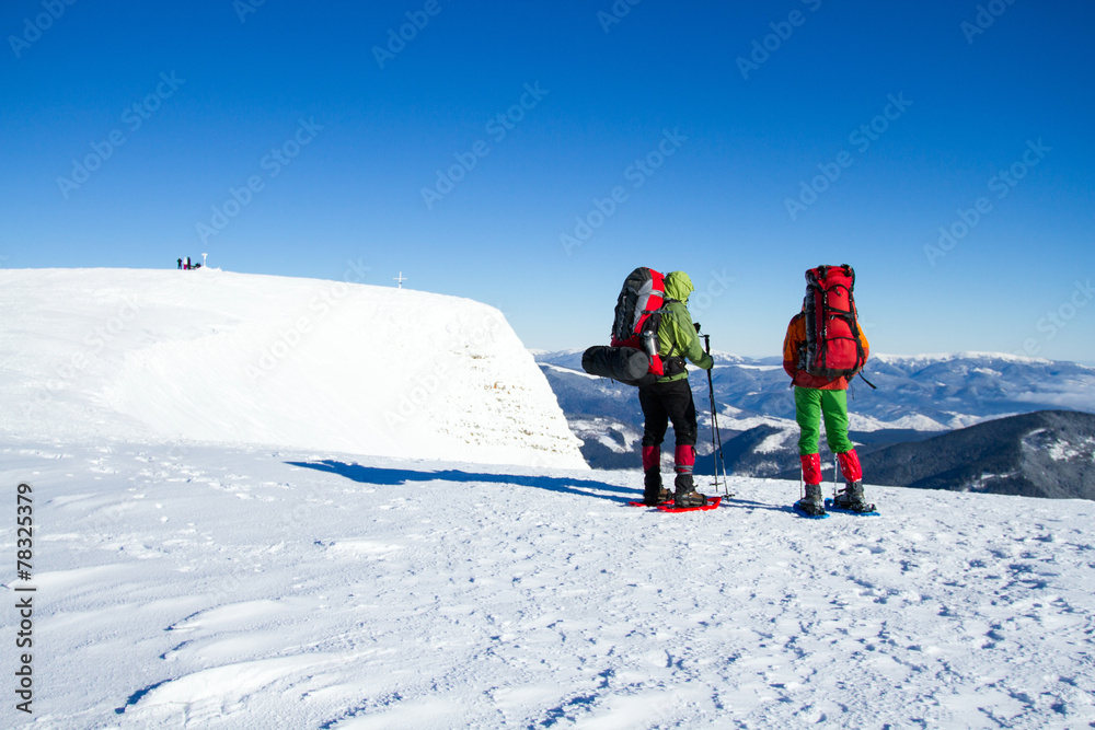 Winter hiking in snowshoes.