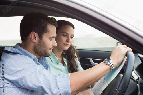 Young couple looking at the map