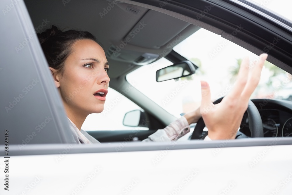 Pretty businesswoman experiencing road rage