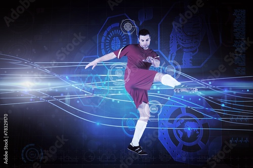 Composite image of football player in red kicking © WavebreakMediaMicro