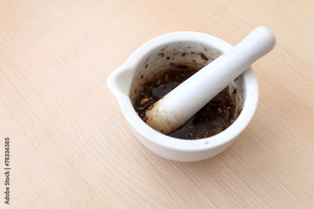 Porcelain mortar with spices Porcelain mortar with spices