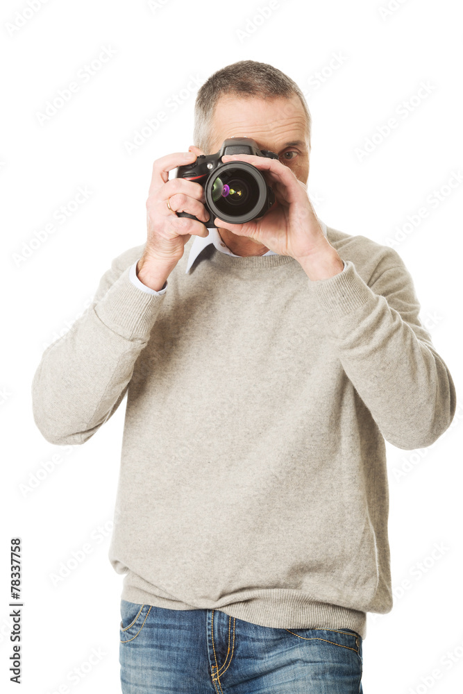 Mature man with photo camera Mature man with photo camera