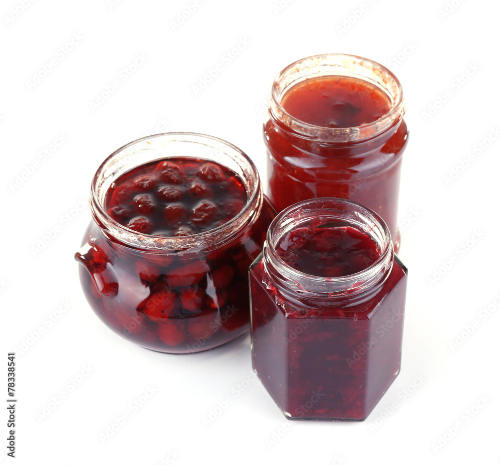 Homemade jars of fruits jam isolated on white background Homemade jars of fruits jam isolated on white background