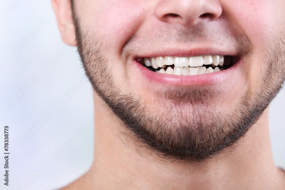 Smiling young man after visit dentist