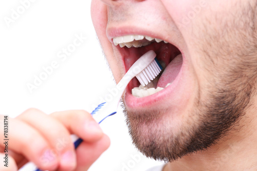 Man with toothbrush isolated on white
