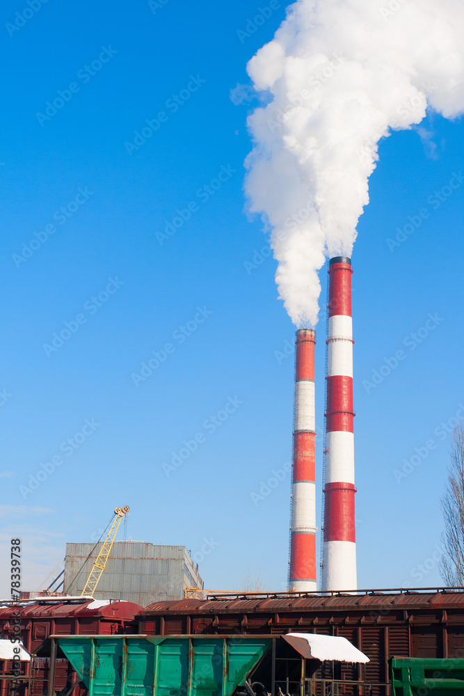 Two smoking chimneys pollution air